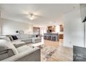 Open-concept living space featuring modern decor, a sectional sofa, and seamless flow to kitchen at 2268 Westbrook Rd, Edgemoor, SC 29712