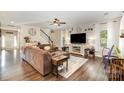 Comfortable living room featuring hardwood floors, an area rug, and natural light from the window at 35 Dorie Dr, Belmont, NC 28012