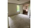 An empty bedroom leading to an en-suite bathroom that includes a sink and a tub at 4006 Hillview Dr, Shelby, NC 28152