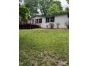 Exterior view of home featuring a wooden deck with lush green lawn and trees at 4006 Hillview Dr, Shelby, NC 28152