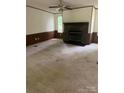 Living room featuring neutral carpet and a stone fireplace at 4006 Hillview Dr, Shelby, NC 28152