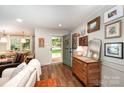 Inviting entryway featuring hardwood floors and charming decor, leading to a dining area at 418 Melody Ln, Shelby, NC 28152