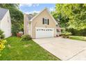 This home features an attached garage and long driveway at 4333 Poplar Grove Dr, Charlotte, NC 28269