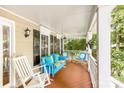 Comfortable seating on the charming front porch at 4333 Poplar Grove Dr, Charlotte, NC 28269
