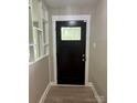 Stylish front door with glass insert and modern hardware at 4524 Cinderella Rd, Charlotte, NC 28213