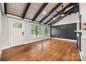 Inviting living room with high ceilings, hardwood floors, and ample natural light at 605 Cobb St, Lowell, NC 28098