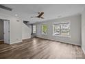 Inviting living space featuring hardwood floors, large windows, and modern finishes providing an airy atmosphere at 6518 Point Comfort Ln, Charlotte, NC 28226