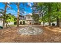Spacious backyard features a stone fire pit area and a wood deck, perfect for outdoor entertaining at 8020 Sheckler Ln, Matthews, NC 28104