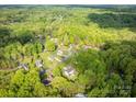 Scenic aerial view of a neighborhood with mature trees and green landscapes at 107 Ingonish Dr, Gastonia, NC 28056