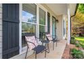 Charming front porch seating area, great for relaxation at 107 Ingonish Dr, Gastonia, NC 28056