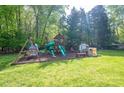 A spacious backyard playground with a swing set and slide at 107 Ingonish Dr, Gastonia, NC 28056