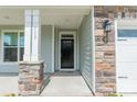 Close up of front door with stone pillar and the house number 113 at 113 Summerhill Dr, Mooresville, NC 28115