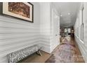 Bright hallway with a zebra-striped bench, stylish runner rug, and modern wall accents at 1160 S Kings Dr, Charlotte, NC 28207