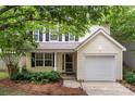 Charming two-story home featuring a garage and a well-manicured front yard at 1410 Swaying Branch Ln, Clover, SC 29710