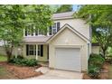 Charming two-story home featuring a garage and a well-manicured front yard at 1410 Swaying Branch Ln, Clover, SC 29710