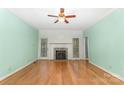 Bright living room with hardwood floors, fireplace, and large windows offering natural light at 1750 Trellis Dr, Rock Hill, SC 29732