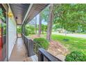 Quaint front porch with view of landscaped yard, perfect for relaxing and enjoying the outdoors at 2009 Pinevalley Rd, Rock Hill, SC 29732