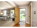Welcoming entryway with hardwood floors, open to a cozy living area at 2443 Knickerbocker Dr, Charlotte, NC 28212