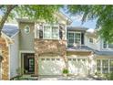 Charming townhome with stone accents, attached two car garage, and neutral siding at 2548 Chasewater Dr, Fort Mill, SC 29707