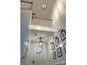 Bright foyer featuring high ceilings, stylish lighting fixtures, and picture frame molding at 2548 Chasewater Dr, Indian Land, SC 29707