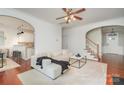 Cozy living room featuring hardwood floors, a ceiling fan, and an open floor plan at 2548 Chasewater Dr, Indian Land, SC 29707