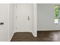 Clean entryway with neutral paint and laminate floors at 406 Wilcrest Dr, Matthews, NC 28105