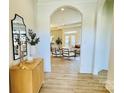 Elegant foyer features hardwood floors, arched doorways and neutral color palette at 409 Newstyle Way, Gastonia, NC 28056