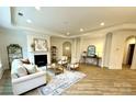 Open concept living room features hardwood floors, fireplace and neutral color palette at 409 Newstyle Way, Gastonia, NC 28056