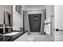 Modern bathroom showcasing a sleek vanity, black tiled shower, and clean, contemporary design at 411 Newstyle Way, Gastonia, NC 28056