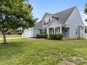 Beautiful two-story home with a two-car garage and a lush green lawn at 423 Courtland Ct, Kannapolis, NC 28081