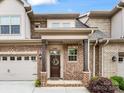 Inviting covered front entrance and an attached garage for this lovely townhome at 5030 Waldron Meadow Dr, Charlotte, NC 28226