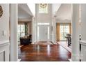 Grand foyer featuring hardwood floors, soaring ceilings, and elegant columns at 701 Larkridge Ct, Rock Hill, SC 29730