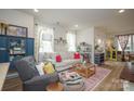 Inviting living room with bright natural light, hardwood flooring, and stylish decor at 711 Beaty St, Davidson, NC 28036