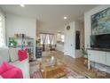 Bright and open living room offering a seamless flow and inviting ambiance at 711 Beaty St, Davidson, NC 28036