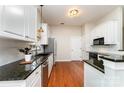 Charming kitchen with stainless steel appliances, granite countertops, and a stylish undermount sink at 7211 Baniff Cir, Charlotte, NC 28277