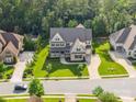 Aerial view of the home, showcasing its landscaped yard and neighborhood at 1008 Ladera Dr, Waxhaw, NC 28173