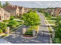 Neighborhood street view showcases manicured lawns and beautiful brick homes at 1008 Ladera Dr, Waxhaw, NC 28173