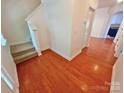 Bright foyer featuring hardwood floors and staircase to the upper level at 11624 Truan Ln, Cornelius, NC 28031