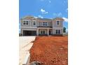 Charming two-story home featuring a spacious two-car garage, situated on a large lot with blue skies in the background at 118 Kerr Walk Dr # 17, Statesville, NC 28677