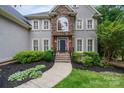 Inviting home featuring stone accents, well-maintained landscaping, and a welcoming walkway to the front entry at 2006 Sandy Pond Ln, Waxhaw, NC 28173