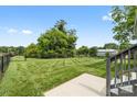 Large, fenced backyard featuring well-maintained lawn with a storage shed in the rear at 2996 N Lookout St, Claremont, NC 28610
