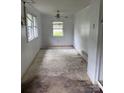 Empty living room with unfinished floors and basic lighting fixture at 341 Talley St, Troutman, NC 28166