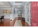 Bright foyer with hardwood floors, wainscoting and a view of the staircase at 4117 Bright Rd, Charlotte, NC 28214
