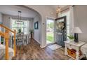 Inviting home foyer with hardwood floors and an open view into the dining area and staircase at 841 Lacebark Dr, Rock Hill, SC 29732