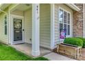 A close up of the townhome's charming front door with a decorative wreath and welcoming decorations at 841 Lacebark Dr, Rock Hill, SC 29732