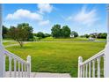 Picturesque view from the front porch overlooking an expansive green yard at 924 Secrest Hill Dr, Monroe, NC 28110