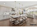 Open kitchen features a large island with seating, stainless appliances, and hardwood flooring at 1001 Kingbird Ln # 15, Clover, SC 29710