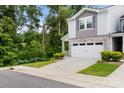Charming two-story home with stone accents, neutral siding, a two car garage, and a nice yard at 1028 Maltby St, Charlotte, NC 28217