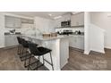 Kitchen featuring granite countertops, stainless steel appliances, and an island with barstool seating at 1039 20Th Avenue Se Loop, Hickory, NC 28602