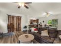 Cozy living room with a comfortable sofa and view into an eat-in kitchen and dining area at 113 Robinette Ln, Statesville, NC 28625